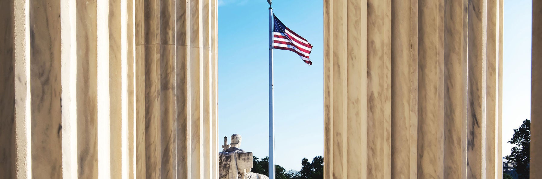 US flag between marble columns